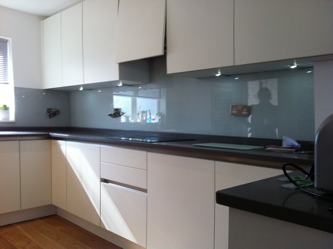 Grey glass kitchen splashback with LED lighting in Catford
